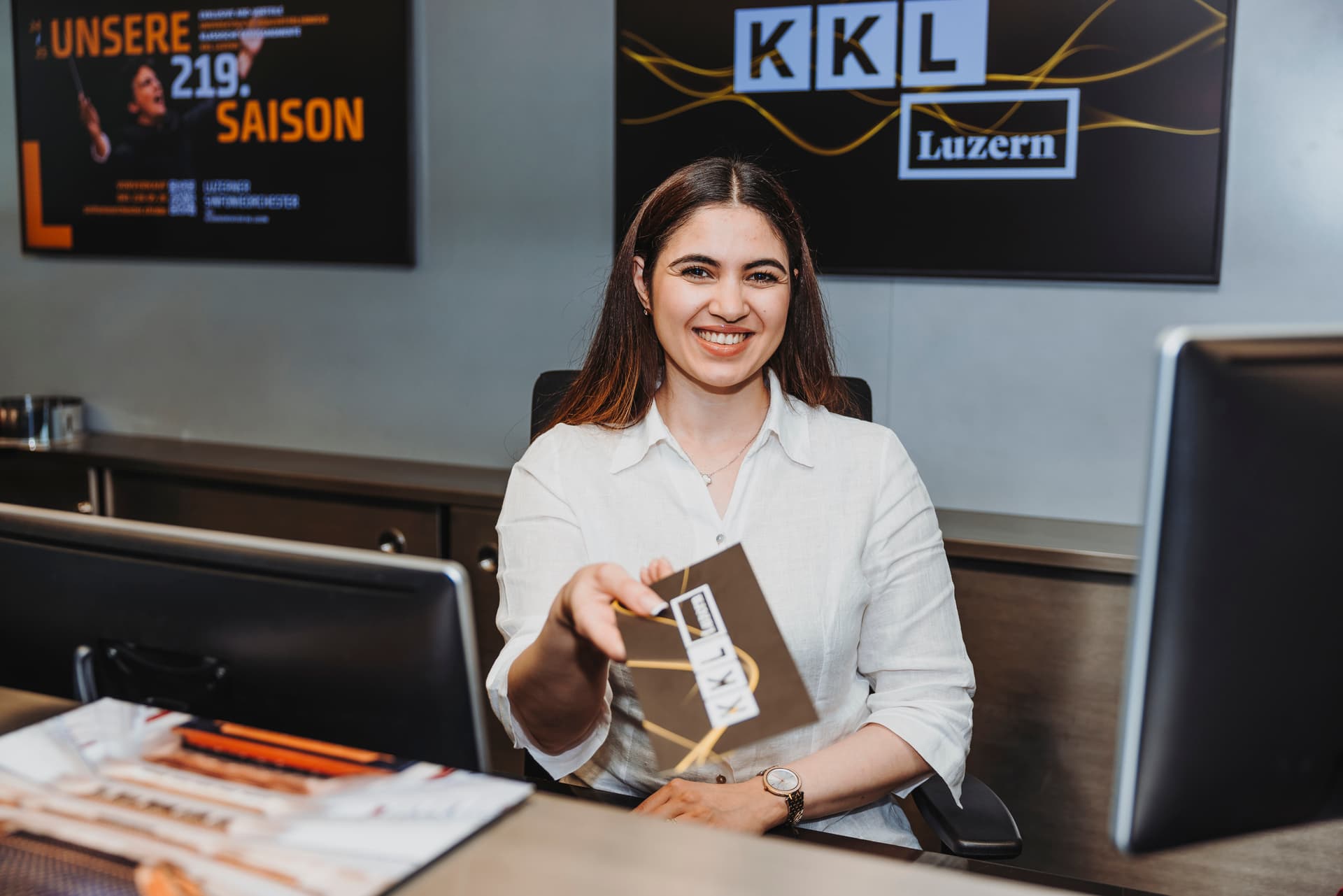 Ticketing employee, at the ticket counter at KKL Luzern