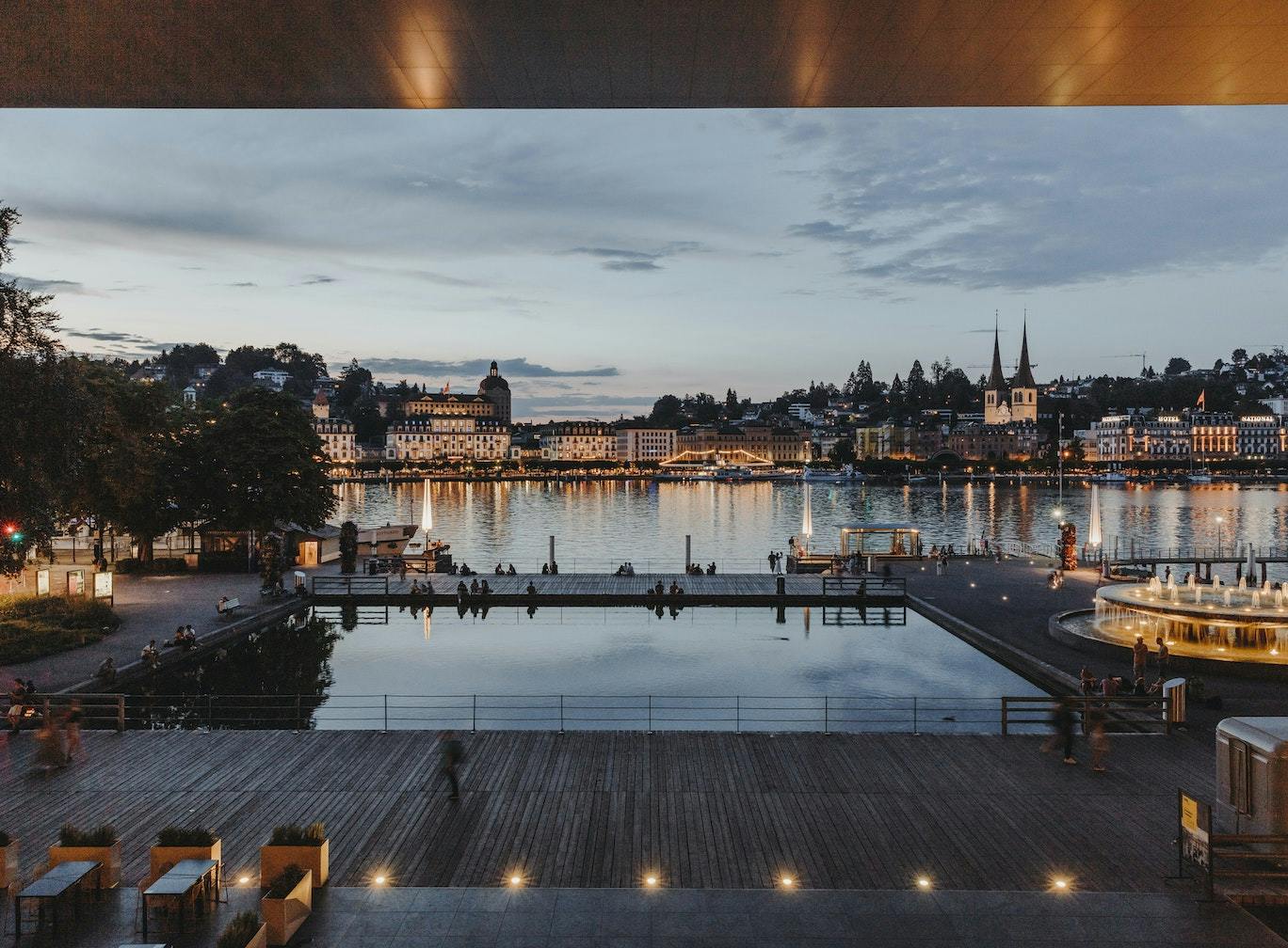 The Lucerne Terrace at the KKL Lucerne with a view of Lucerne in the evening